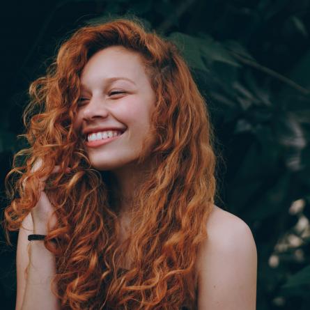 UK female model smiling while posing